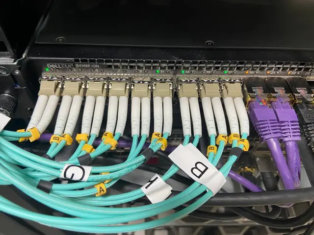 Fibre from each block lands on the core switch, every run labelled so faults are found in minutes.