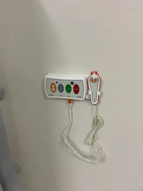 A bedside nurse-call unit: the patient calls, and the call shows at the nurses’ station until a nurse attends.