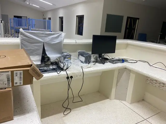 Workstations set up and connected at a nurses’ station.